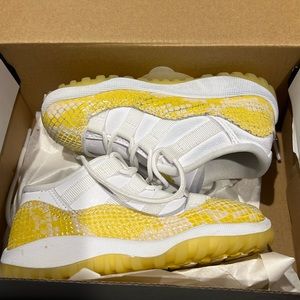 Used Jordan 11 Retro low toddler size 8 yellow and white.